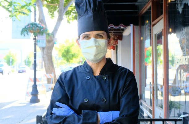 istock Chef fast food restaurant owner posing wearing a mask and protective gloves 1224054112