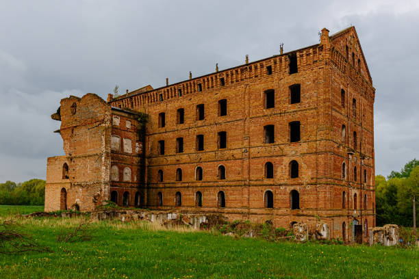 istock Abandoned red brick industrial building, ruined former water mill 1224054320