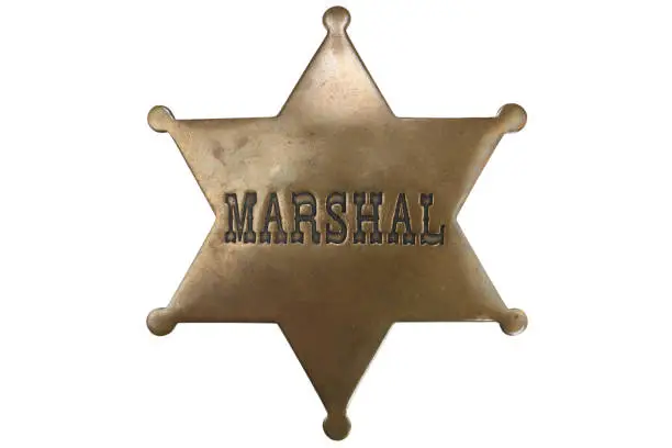 Old Western-style marshal badge isolated on white background