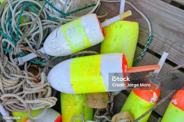 Colorful Lobster Floats Decorate A Wooden Lobstrermans Dock On The Maine Coast Stock Photo - Download Image Now