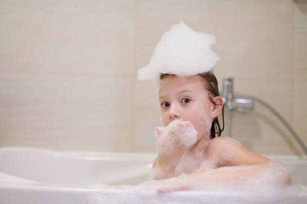 istock little girl in bath playing with soap foam 1224058003