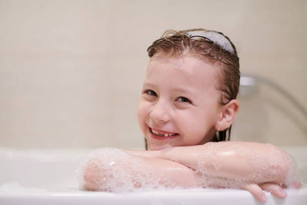 istock little girl in bath playing with soap foam 1224058021
