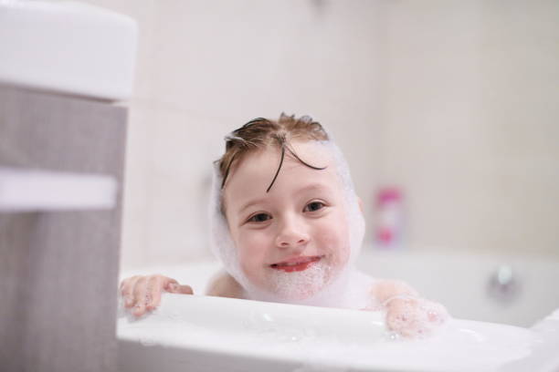 istock little girl in bath playing with soap foam 1224058035