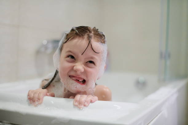 istock little girl in bath playing with soap foam 1224058036