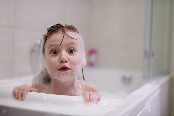 istock little girl in bath playing with soap foam 1224058037