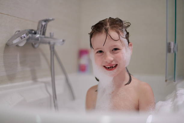 istock little girl in bath playing with soap foam 1224058043