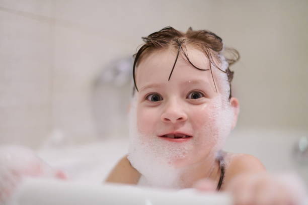 istock little girl in bath playing with soap foam 1224058047