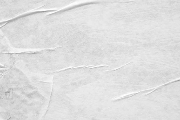 istock Blank white crumpled and creased paper poster texture background 1224060153