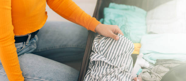 istock girl collects suitcase 1224060188