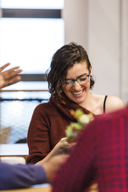 istock She can't help laughing at her colleagues jokes 1224060296