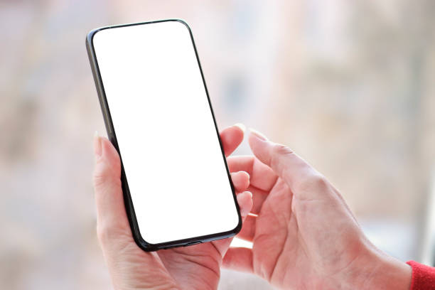istock Female hand with smartphone, white blank screen with copy space. 1224060949