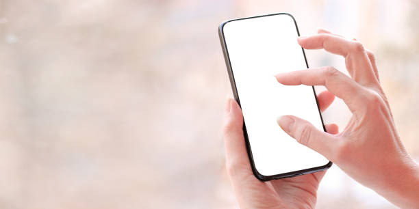istock Female hand with smartphone, white blank screen with copy space. 1224060952