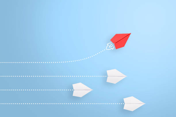 istock Change concepts with red paper airplane leading among white 1224064039
