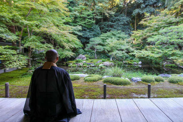 istock Buddhist monks performing zen in the fresh green 1224067326