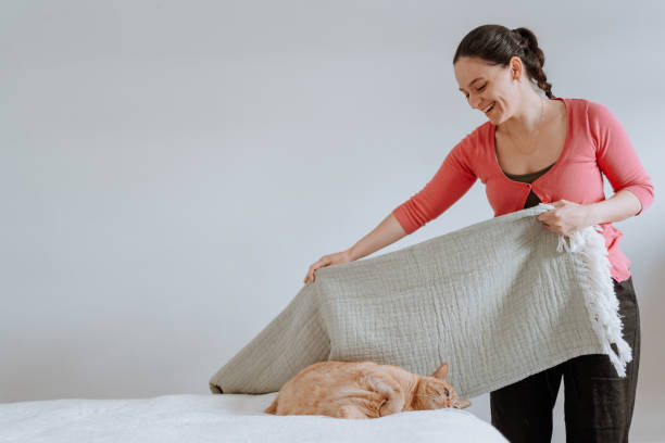 istock Woman arranging bed 1224068432