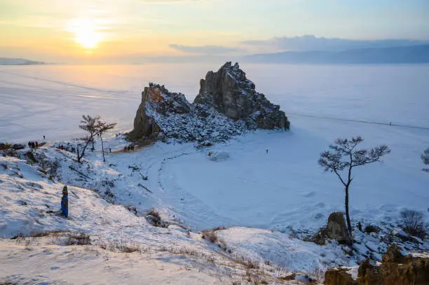 Photo of Evening view of Shaman rock one of sacred place in frozen lake Baikal in winter season of Siberia, Russia.