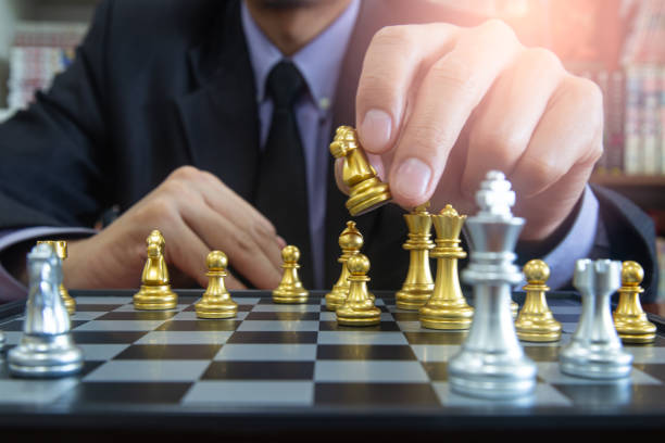 istock Chess game on chess board on stock market or forex trading graph chart for financial investment concept. Economy trends for digital business marketing strategy analysis. Abstract finance background. 1224074871