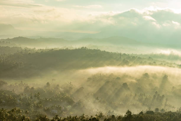 istock mountain layers covered with white mist and orange sun rays at dawn 1224078283