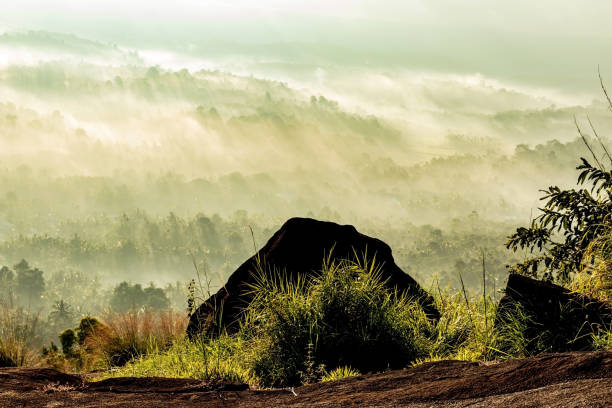 istock mountain layers covered with white mist and orange sun rays at dawn 1224078991