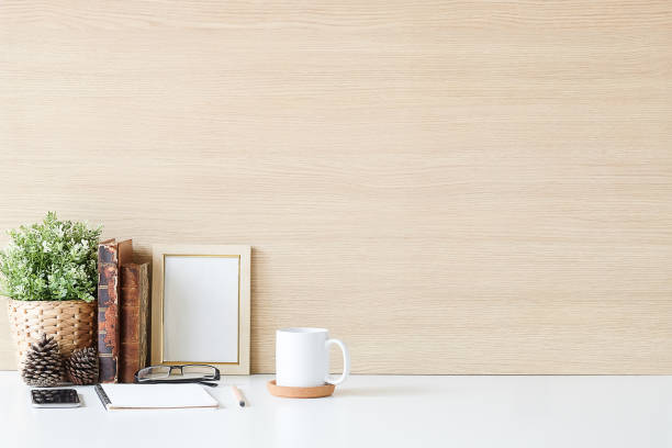 istock Mockup workspace desk and copy space books,plant and coffee on white desk. 1224079158