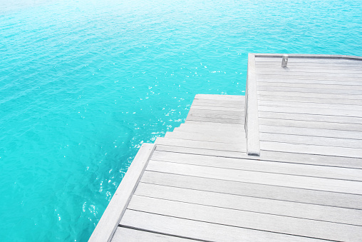 Wooden jetty with turquoise sea