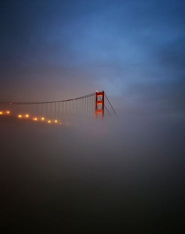 Golden Gate Bridge, San Francisco in Blue Fog viewed from the water.