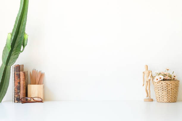 istock Mockup workspace desk and copy space books,plant and coffee on white desk. 1224086218
