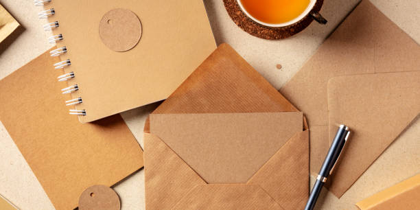 istock A panorama of brown kraft papers, with an envelope, a notebook, a greeting card, a label 1224091070