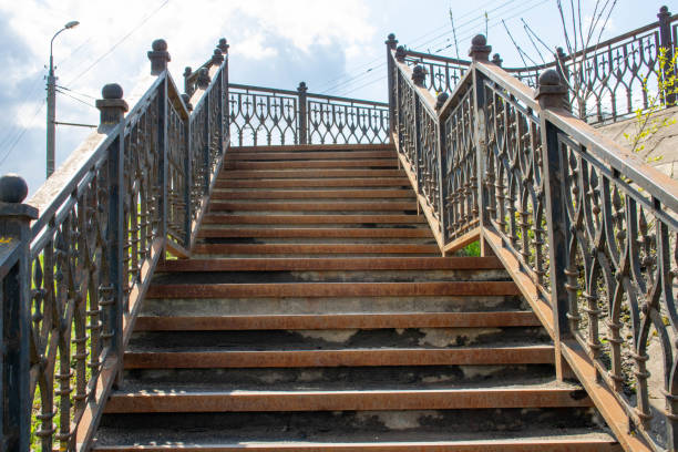 istock Old rusty iron staircase. the railings and steps were stained with rust. 1224091319