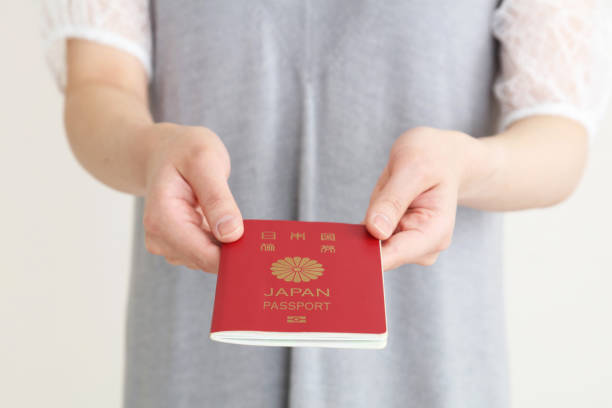 istock A Japanese passport with the woman's hand 1224092145