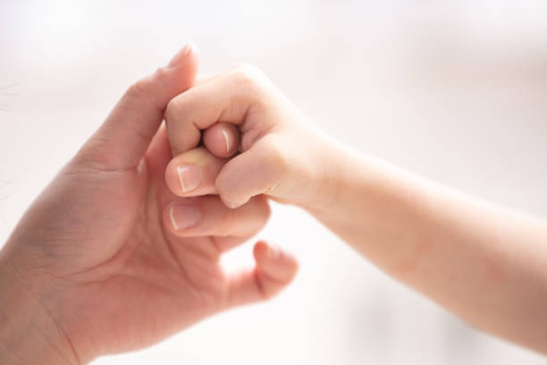 istock Mother and child holding hands 1224093205