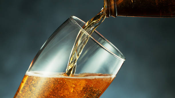 istock pouring beer from bottle into glass 1224094591