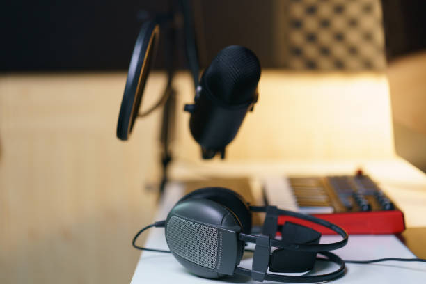istock Earphone, Condenser microphone and sound mixing console board. Equipment for the music studio. 1224094647