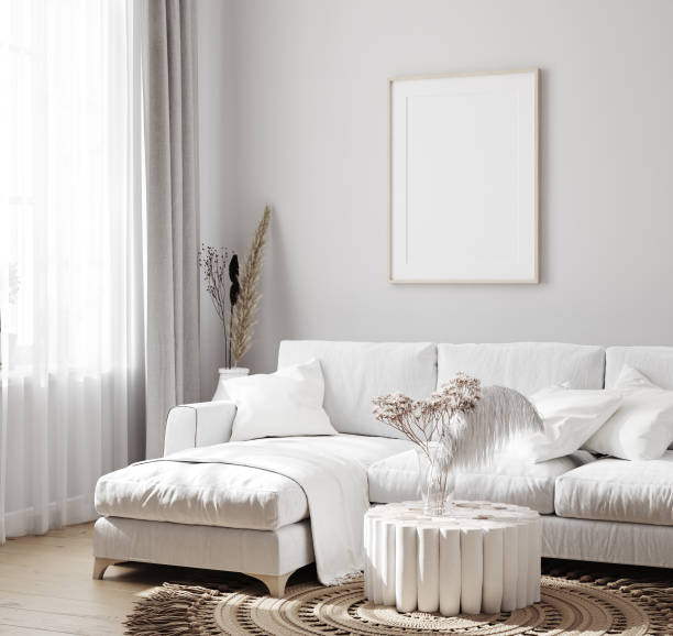 istock White sofa with decor and mockup frames on wall in Scandinavian style interior 1224096466