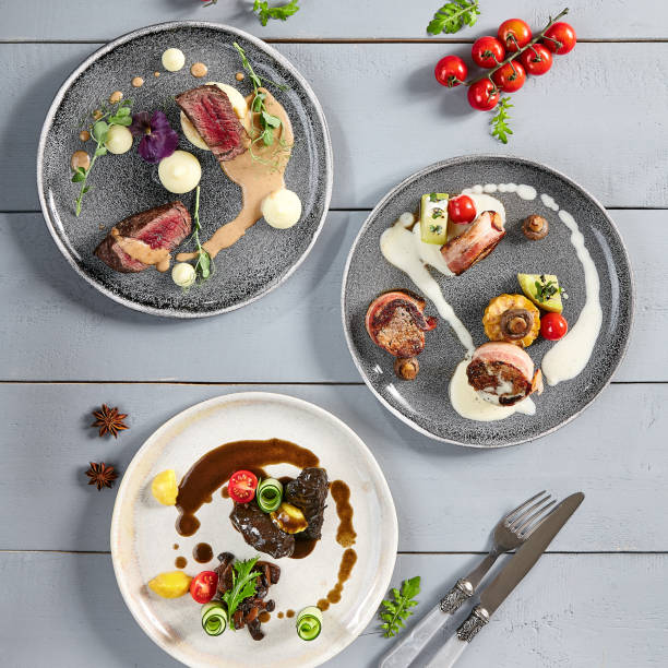istock Hot meals, meat appetizers in ceramic plates top view 1224096522