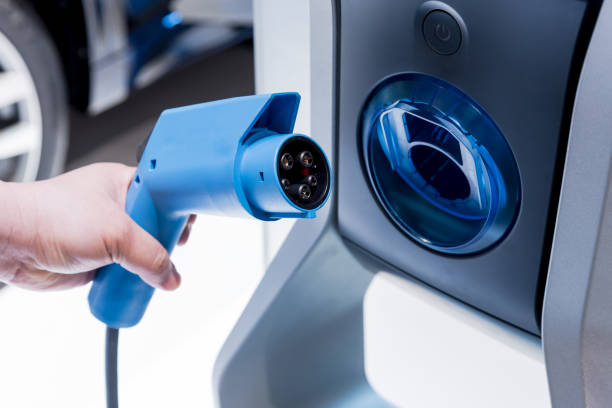 Charging an electric car with chargepoint. Electric vehicle (EV). eco-friendly Lifestyle. stock photo