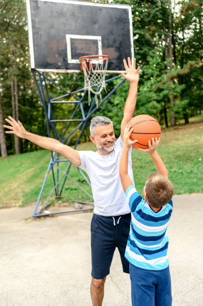 istock Father and son playing basketball 1224096697