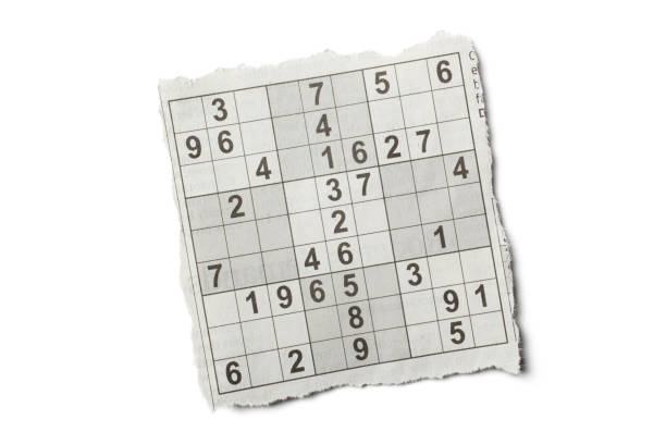 istock Torn Piece of Newspaper Sudoku Puzzle on White Background 1224103583