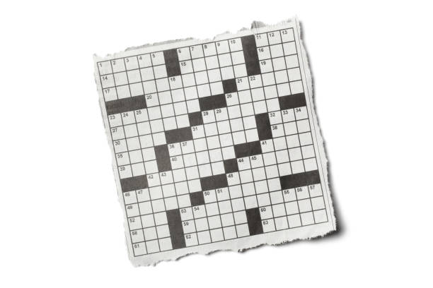 istock Torn Piece of Newspaper Crossword Puzzle on White Background 1224103696