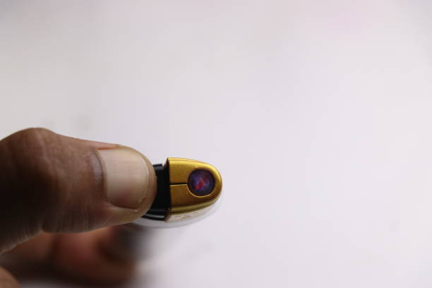istock Flames visible from the lighter which is used to light cigarettes held in hand 1224103808