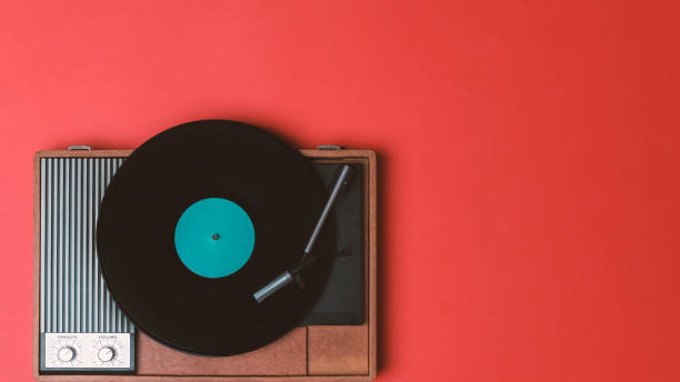 istock Old vinyl player and turnable on a red background 1224104040