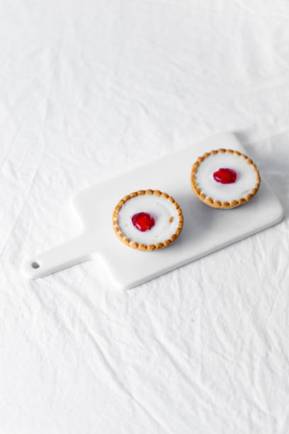 istock Vegan coconut Raspberry tartlets on white background 1224105181