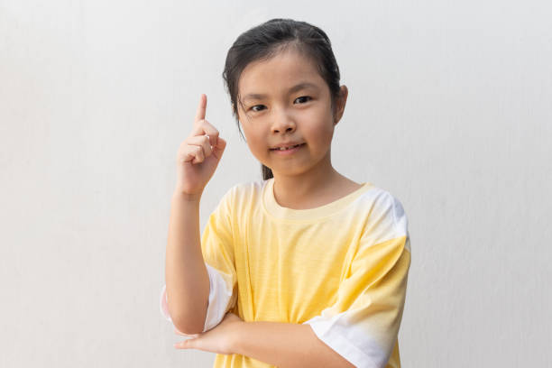 istock Young and cute Asian little girl thinking 1224105497