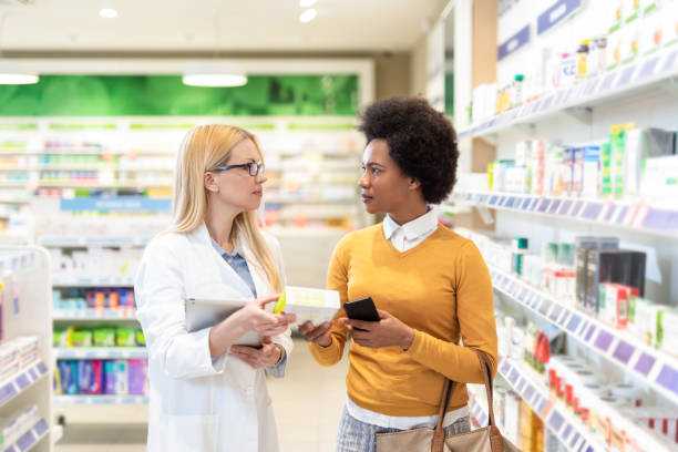 istock Pharmacist helping woman in the Pharmacy. 1224105553