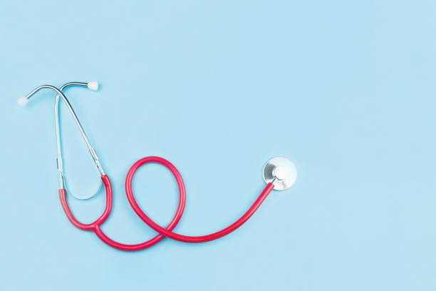 istock Red stethoscope isolated on blue background with copy space,health care concept 1224106250