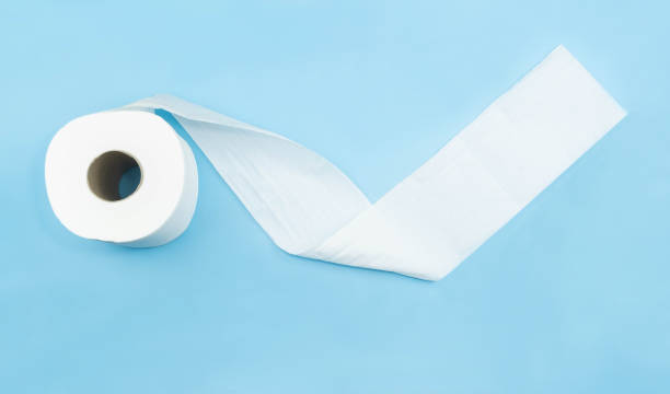 istock Top view,Toilet paper isolated on blue background 1224106352