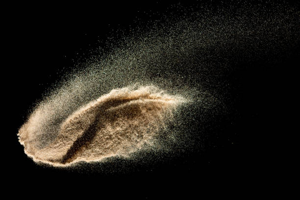 istock Brown sand explosion isolated on black background. Freeze motion of sandy dust splash.Sand texture concept. 1224106400