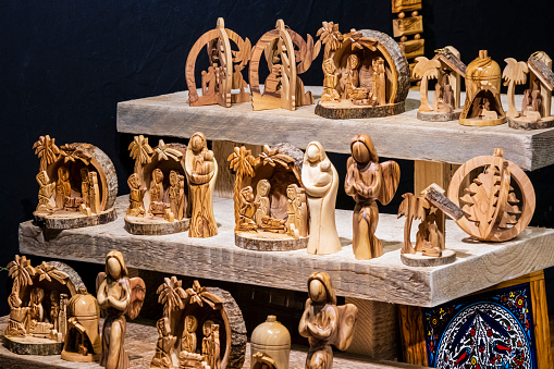 Wooden nativity scenes for sale at the Christmas market set up in the old town of Galway, Ireland.