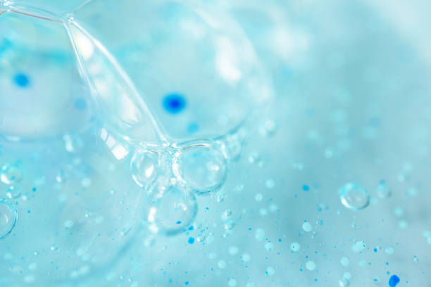 istock Extreme macro bubble blue shower gel with scrub grain texture with selective focus. Concept laboratory tests and research, making cosmetic 1224107724