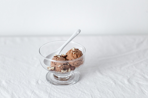 Chocolate ice cream on white table